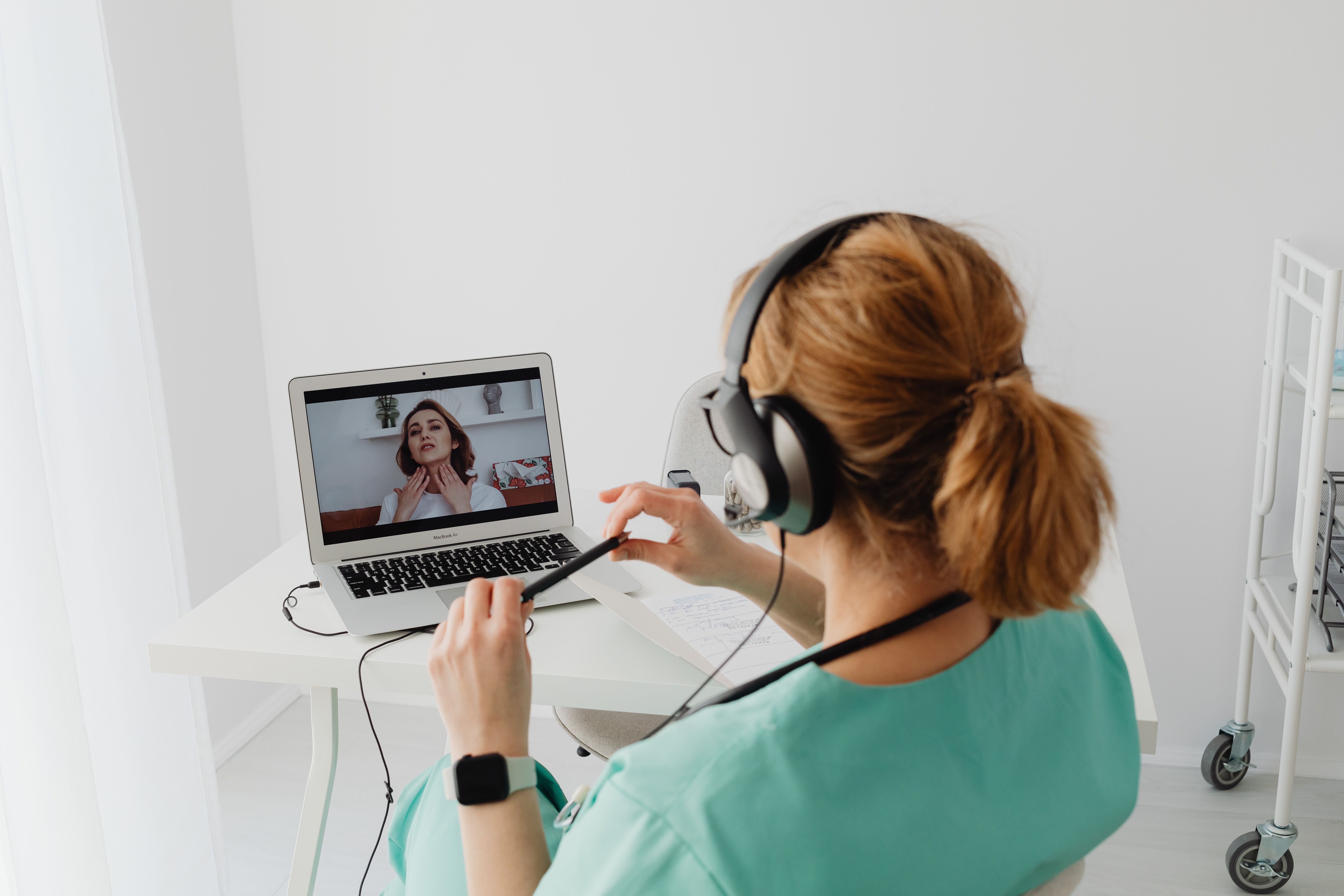 Compassionate therapist providing telehealth care in a calming office setting